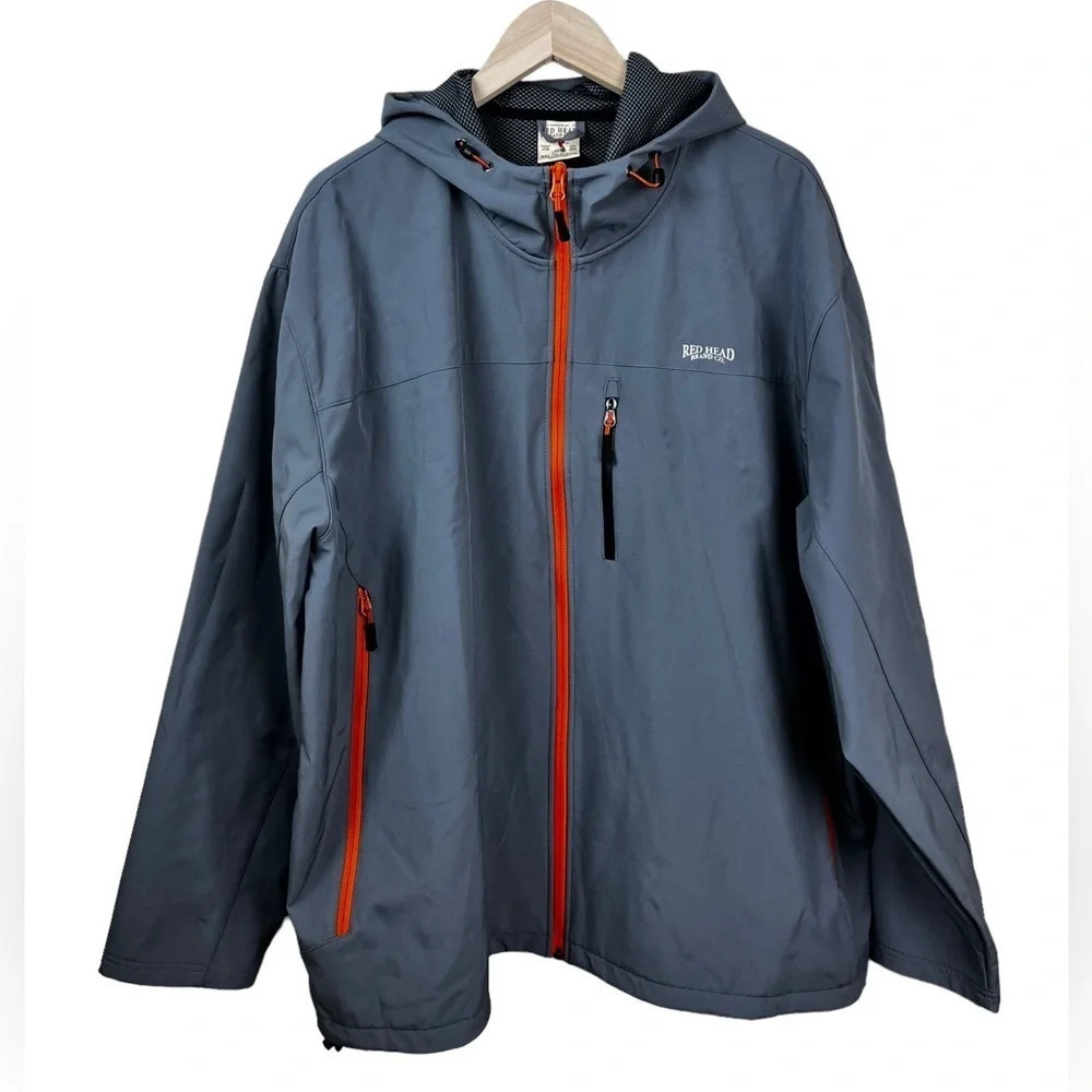 Red Head • Gray Windbreaker